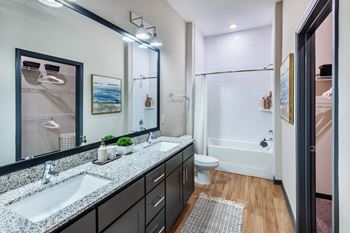 a bathroom with two sinks and a shower and a toilet at Livano Avondale, Arizona 